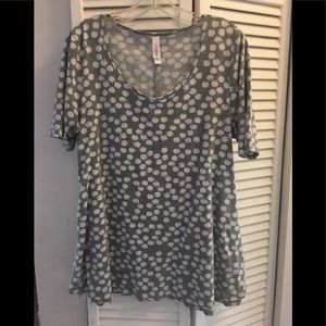 Four lularoe shirts.